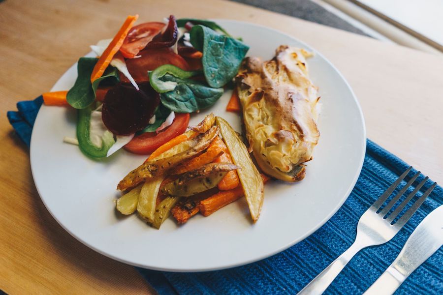 baked fish and chips with rainbow salad